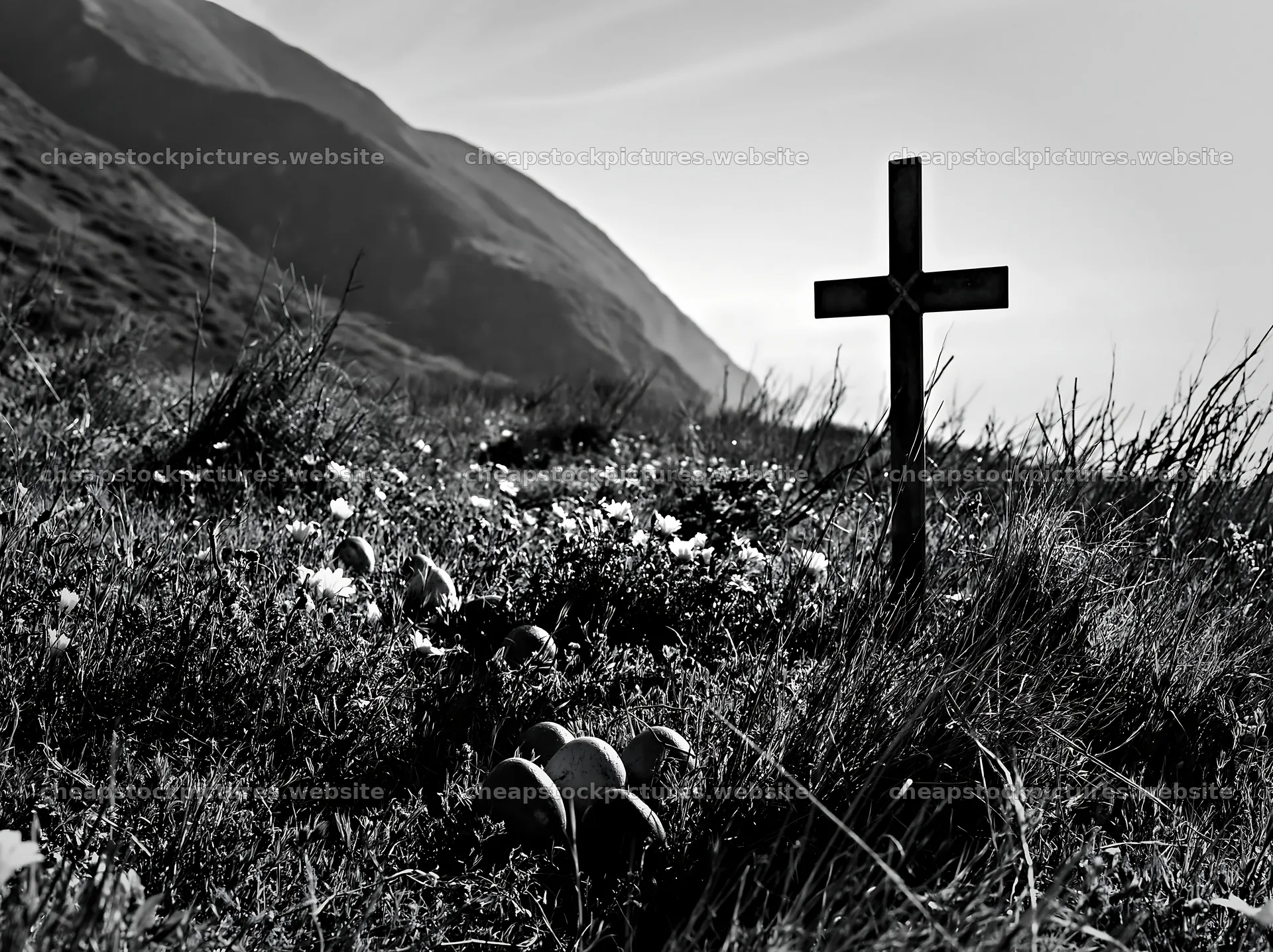 Christian cross in meadow with hills and flowers – stock pictures 9174x6866