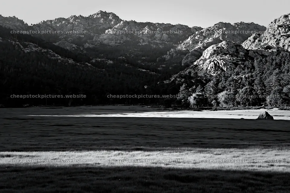 Mountain meadow with sunrays casting shadows on grass – stock pictures 9722x6480