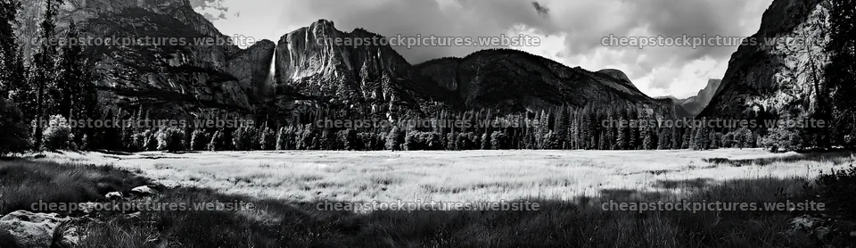 Waterfall in alpine meadow with mountains in background – stock pictures 14762x4268