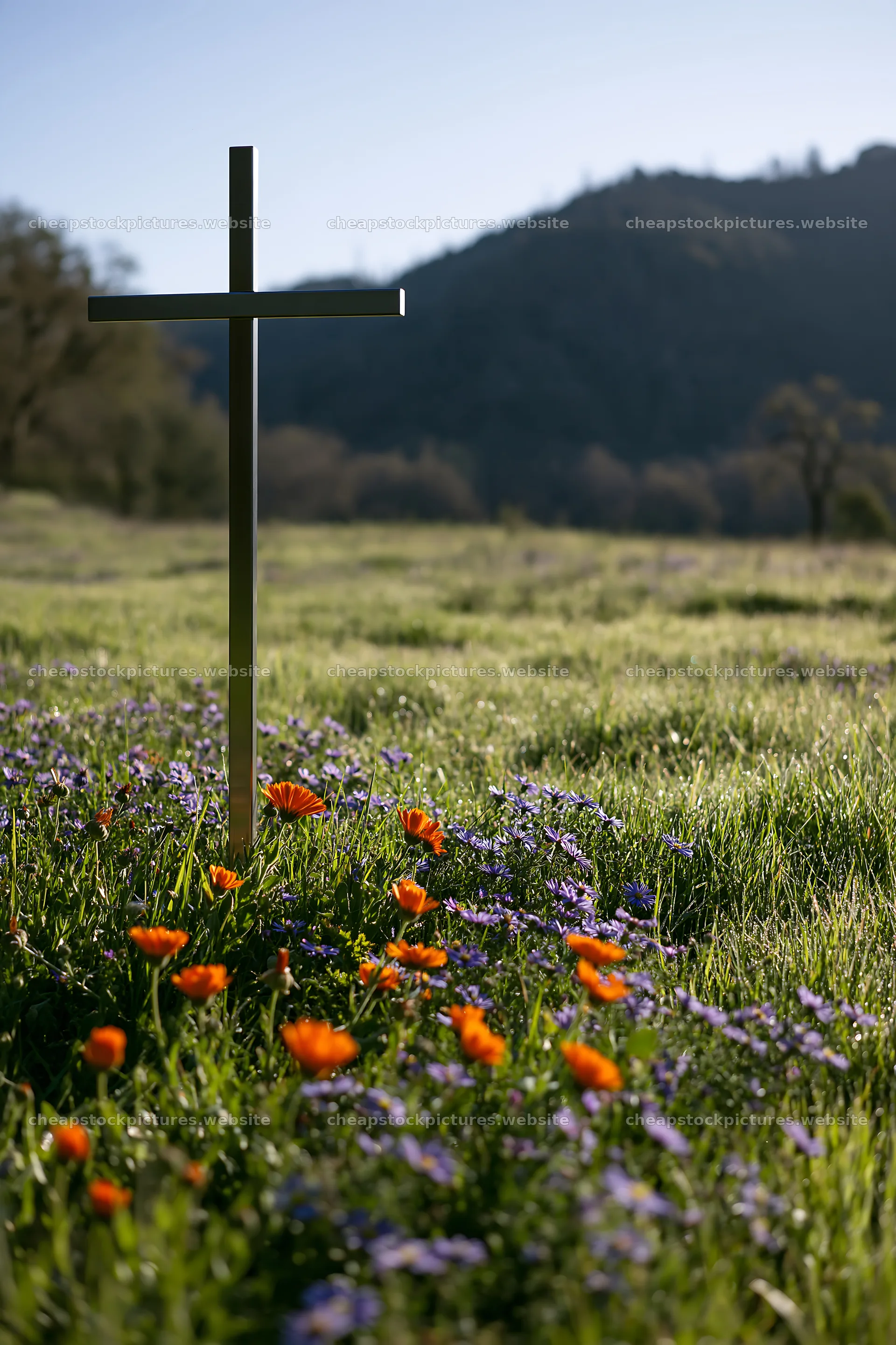 Simple Christian cross in meadow with flowers and mountains – stock pictures 6480x9722