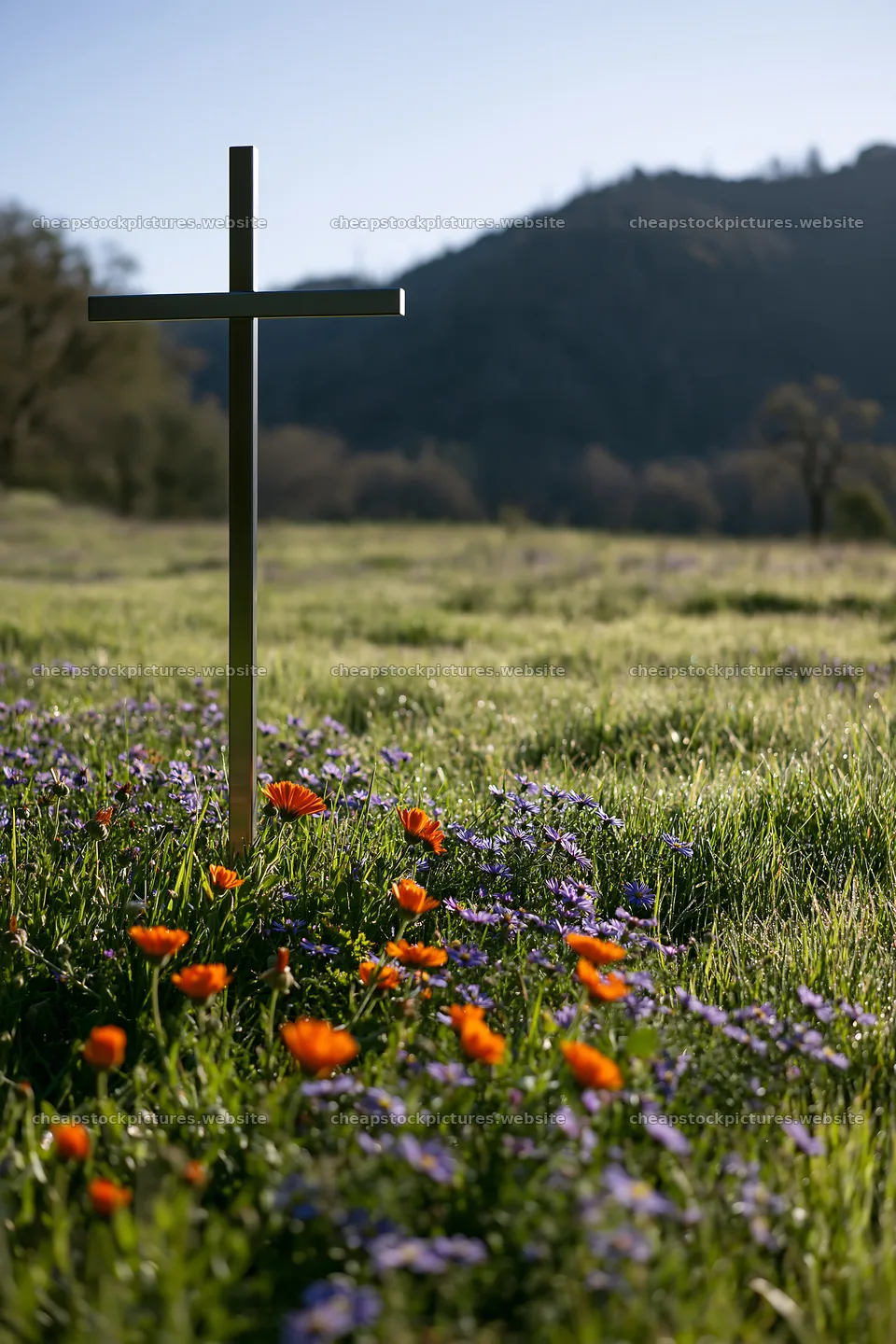 Simple Christian cross in meadow with flowers and mountains – stock pictures 6480x9722