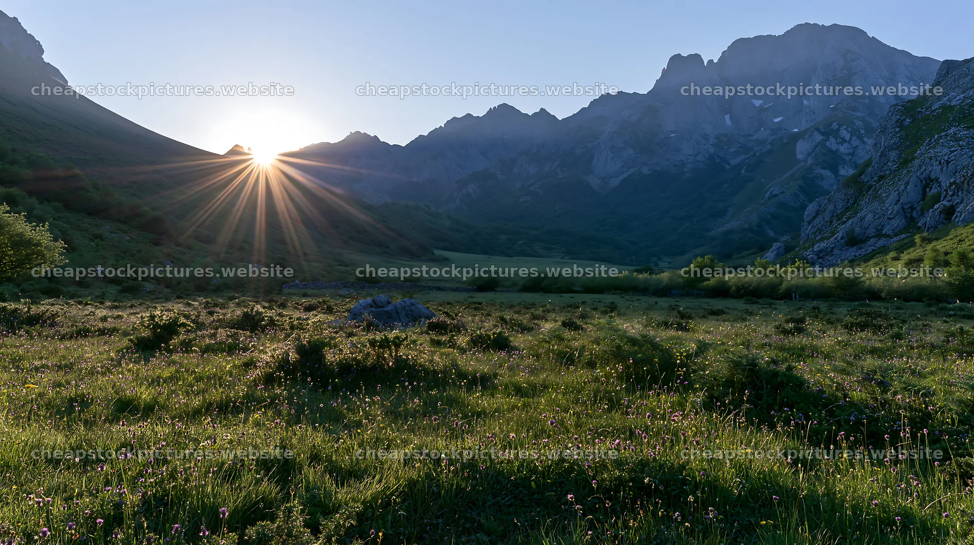 Sunrays shine over Picos de Europa meadow in the morning – stock pictures 10608x5938