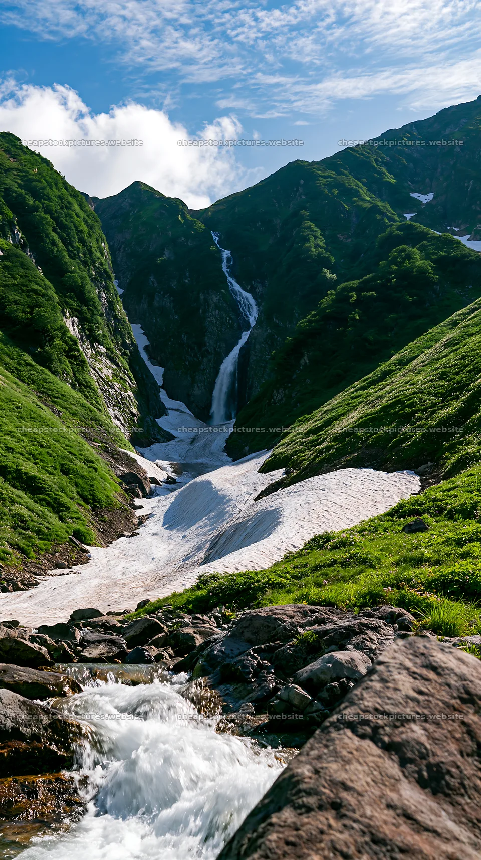 Snowmelt in Toyama alpine meadow with rocks and waterfall – stock pictures 5938x10608