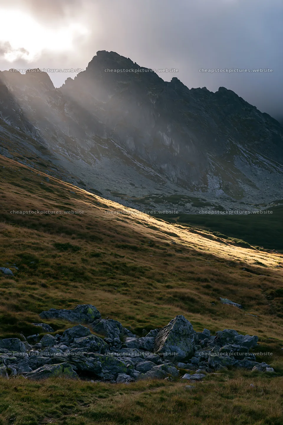 Meadow mountain sunrays illuminate rocky landscape – stock pictures 6480x9722