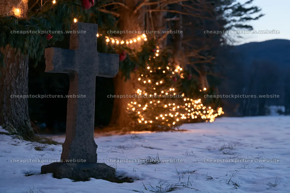 Weathered Christian cross in snowy meadow with lights nearby – stock pictures 9722x6480