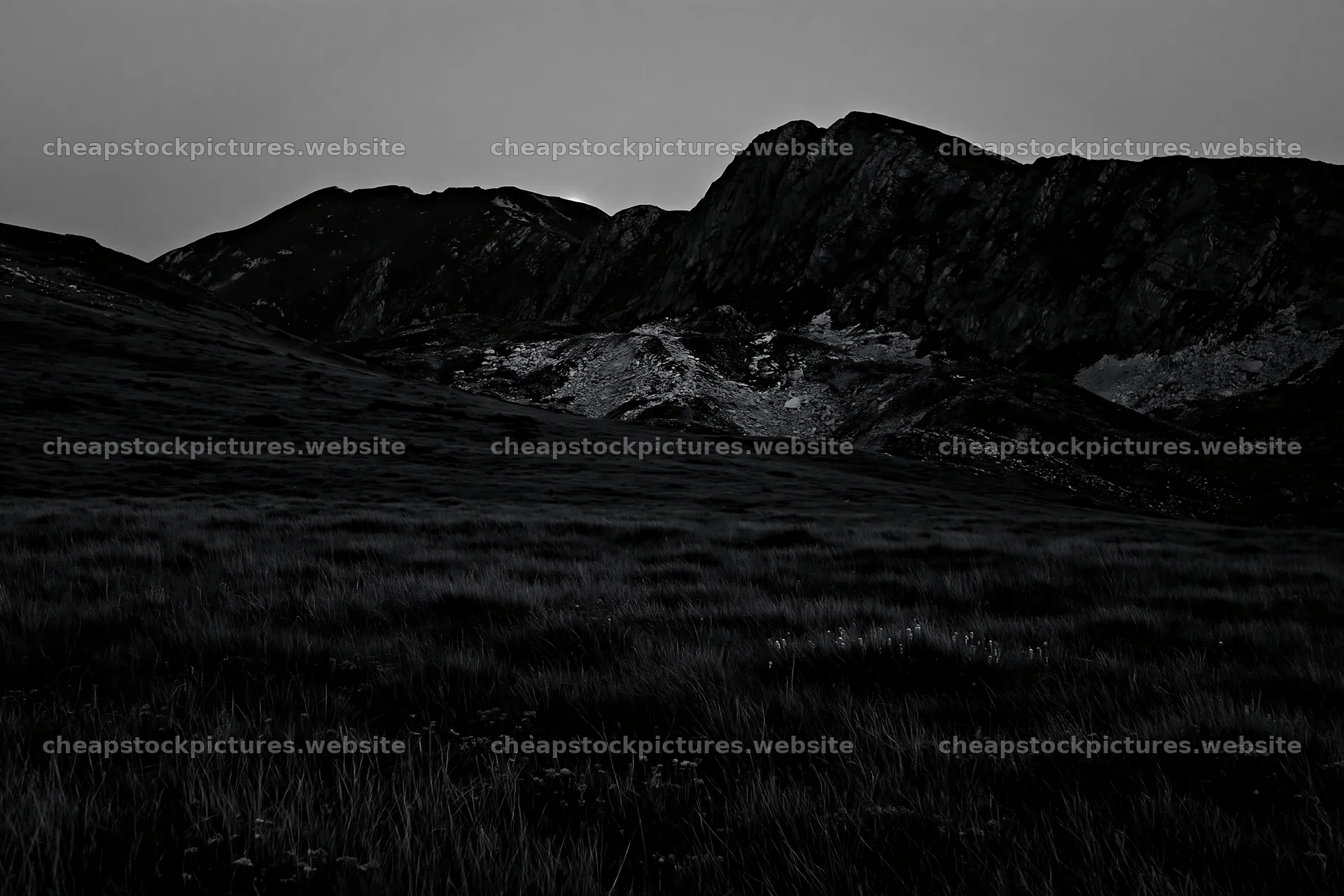 Moonrise over a meadow near mountains at dusk – stock pictures 9722x6480