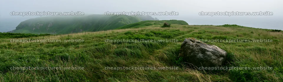 Aomori climate resilient meadow with boulder in green landscape – stock pictures 14762x4268